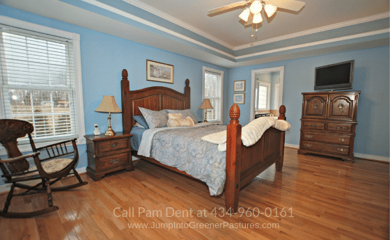 Country Property for Sale in Fluvanna VA - Drift to a peaceful sleep in the cozy master bedroom of this Fluvanna VA country home for sale.